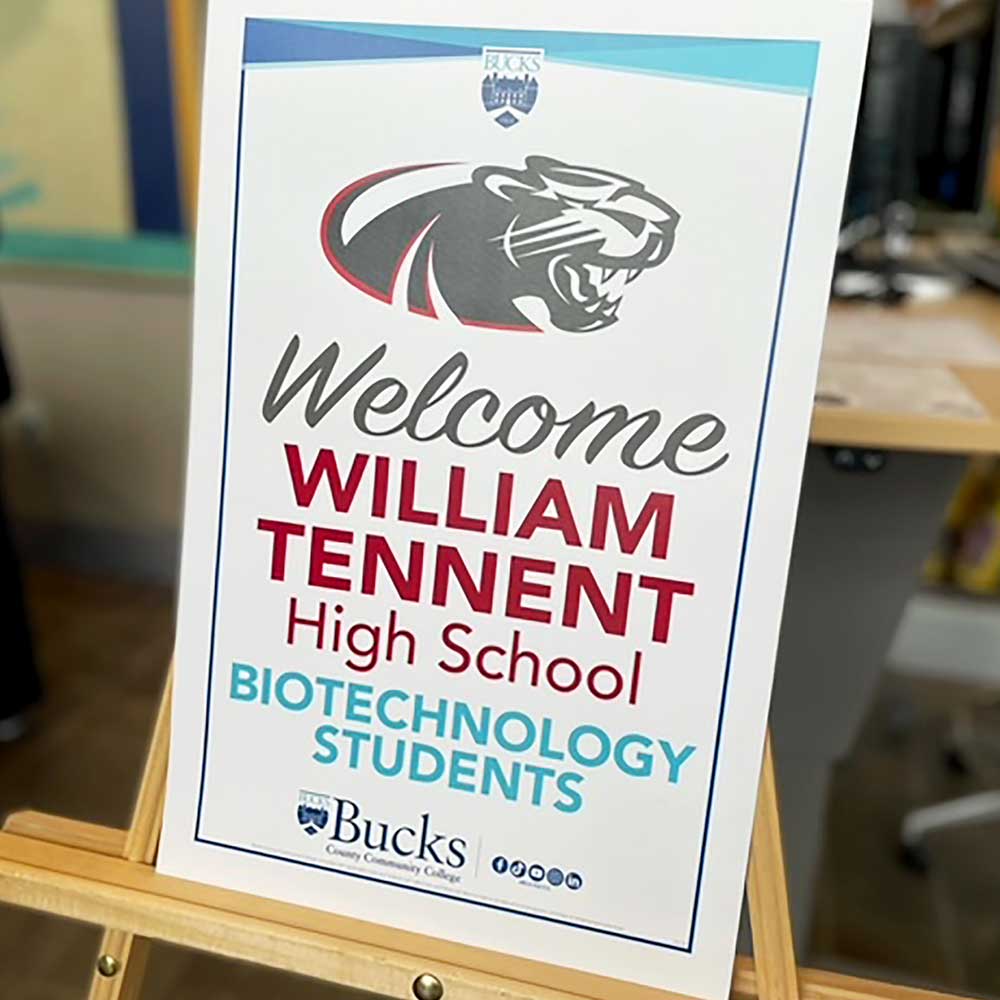 Sign welcoming ExcitED biotechnology students to Bucks County Community College.