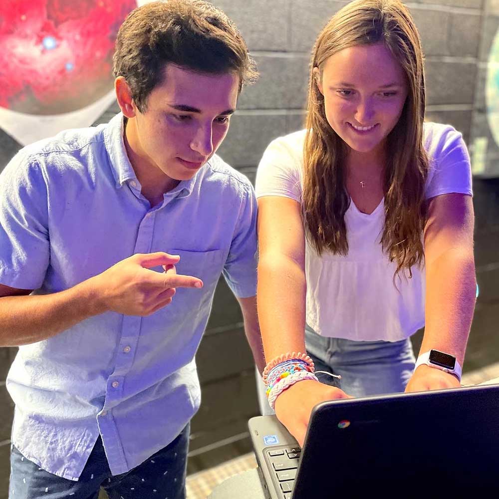 Students working on the first day of their paid summer internship with ProofPilot, a company that maintains a research platform allowing users to design, manage, launch and participate in research studies.